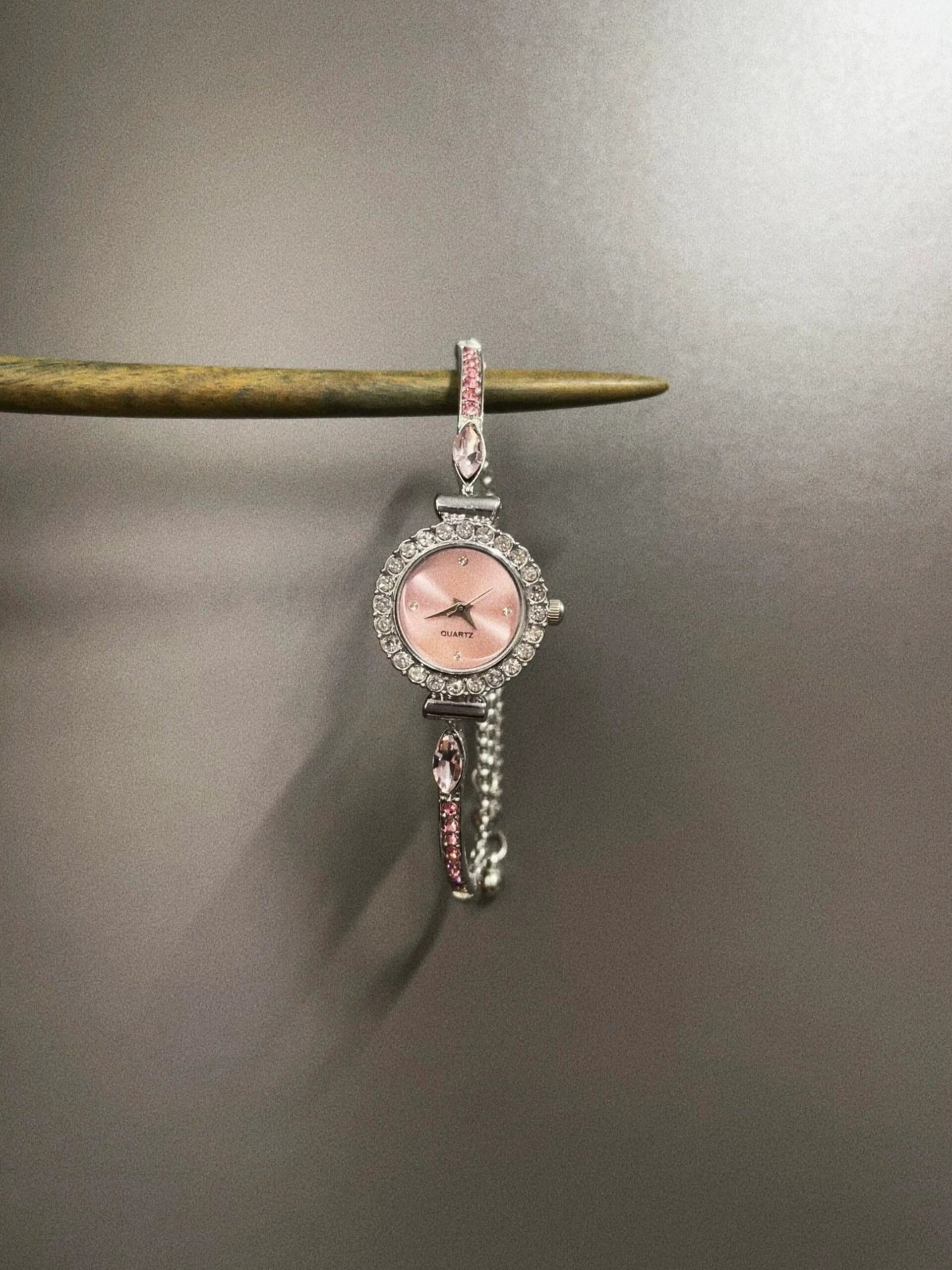 VINTAGE PINK BELTED CIRCLE WATCH